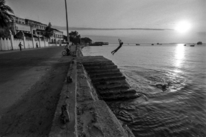 Young men diving on a Zanzibar bay